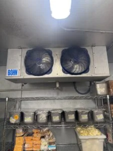 Cleared walk in cooler drain line.