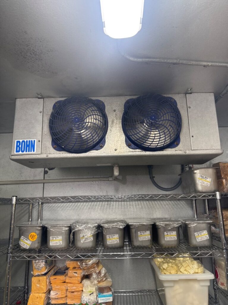 Cleared walk in cooler drain line.
