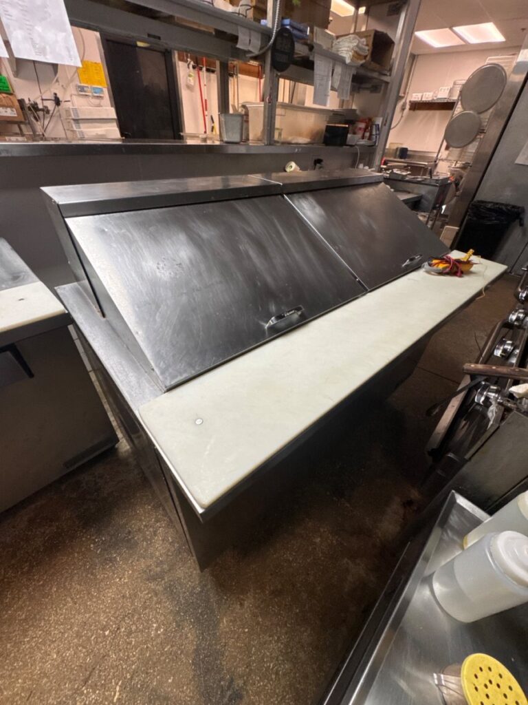 Repaired commercial prep table