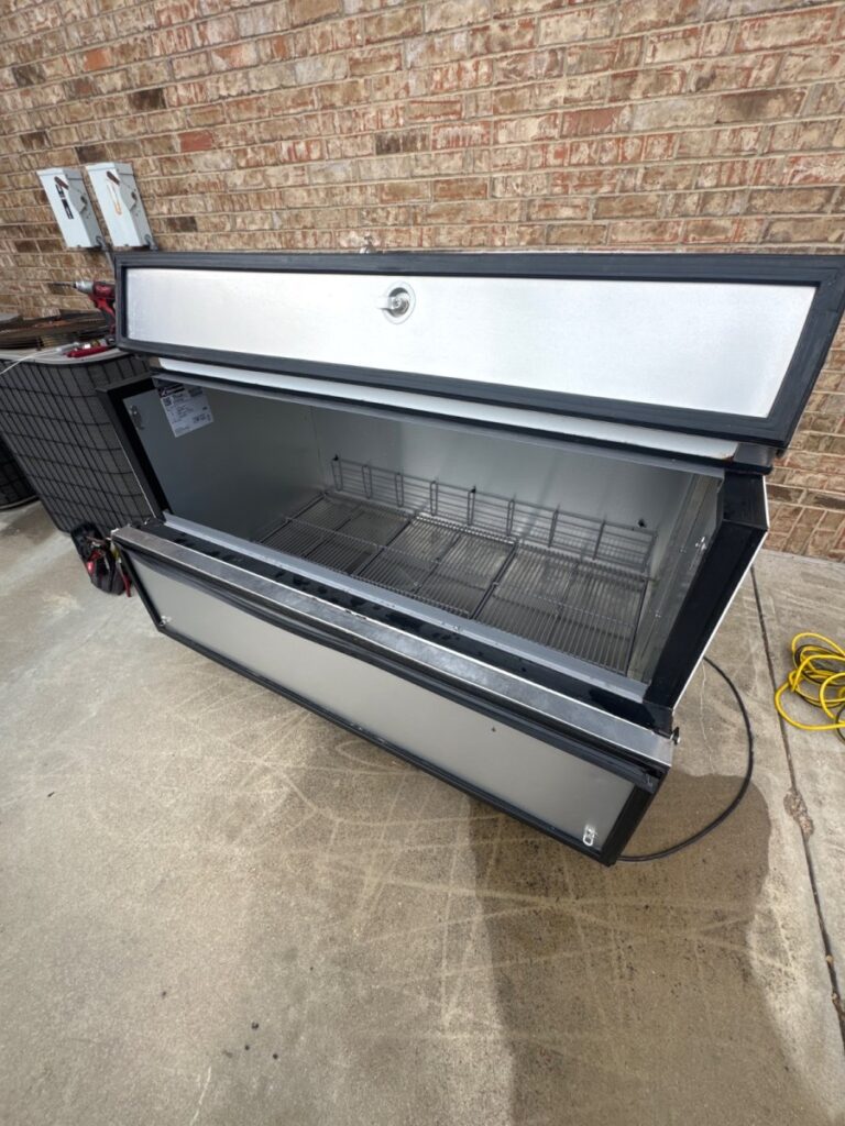 Repaired school milk cooler.