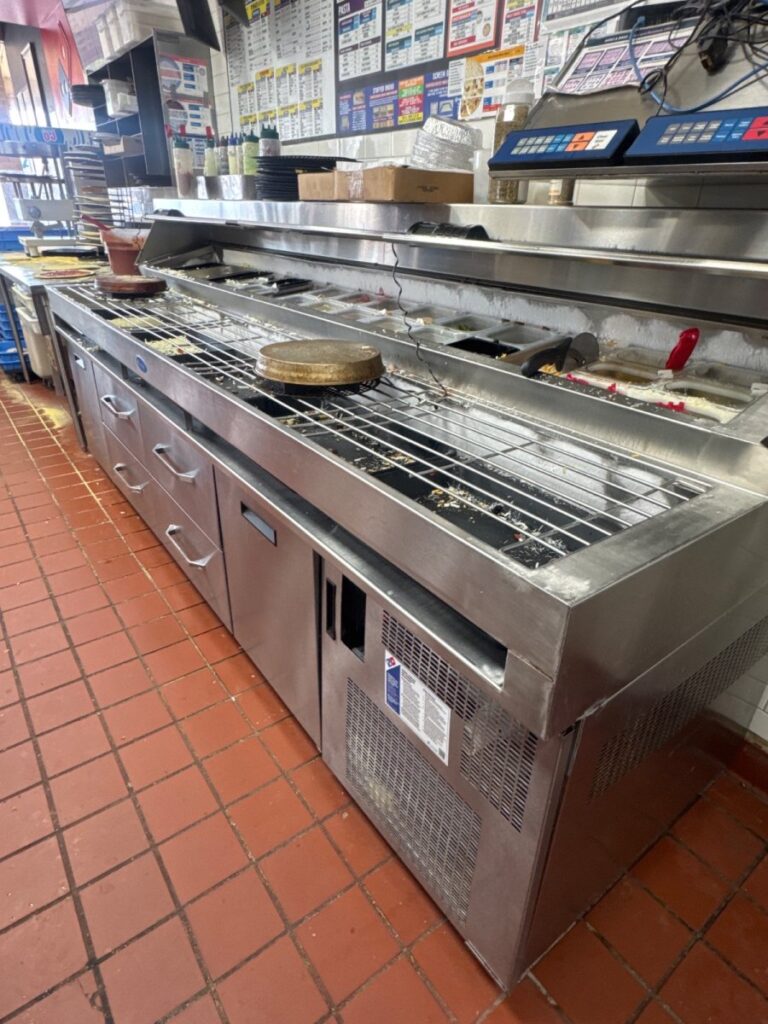 Prepared refrigerant leak located on pizza prep table at Domino’s in North Austin, Texas