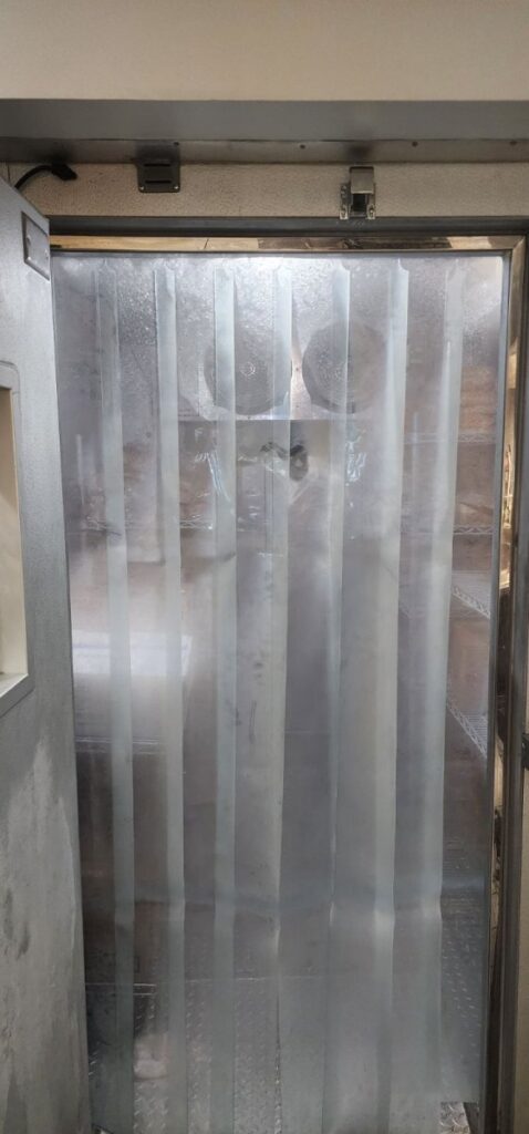 Installed strip curtains on walk in freezer in round rock