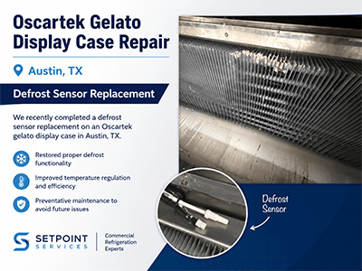 Close-up of an Oscartek gelato display case evaporator coil with frost buildup before defrost sensor repair in Austin, TX