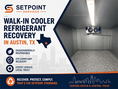 Ceiling-mounted evaporator unit inside an emptied commercial walk-in cooler in Austin, TX