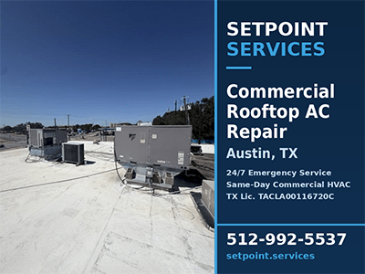 Commercial rooftop packaged HVAC units on a flat white roof at an Austin, TX distribution facility after AC repair