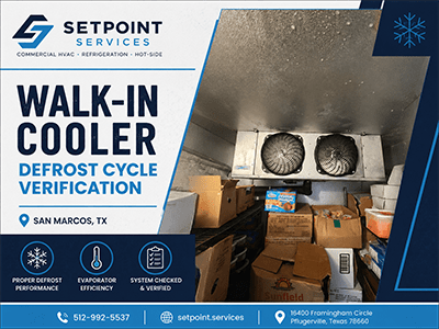 Frost buildup on a walk-in cooler evaporator and ceiling above stored product at a San Marcos, TX restaurant