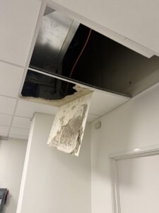 Setpoint Services diagnosed and repaired a commercial HVAC condensate drainage issue for a Trane ceiling-mounted air handler...