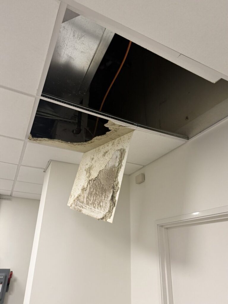 Setpoint Services diagnosed and repaired a commercial HVAC condensate drainage issue for a Trane ceiling-mounted air handler...